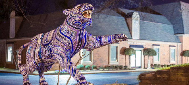 Tiger sculpture outside of a Bank of Bartlett location