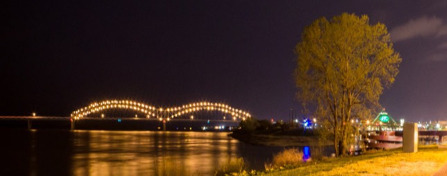 Wide shot of a downtown memphis bridge at night