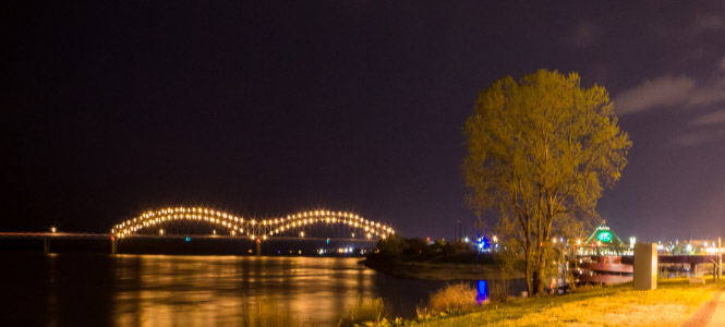 Wide shot of a downtown memphis bridge at night