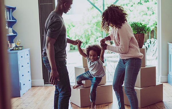 Young family playing in a new house
